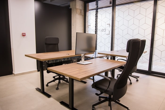 Sit-stand height-adjustable desks for ergonomic work