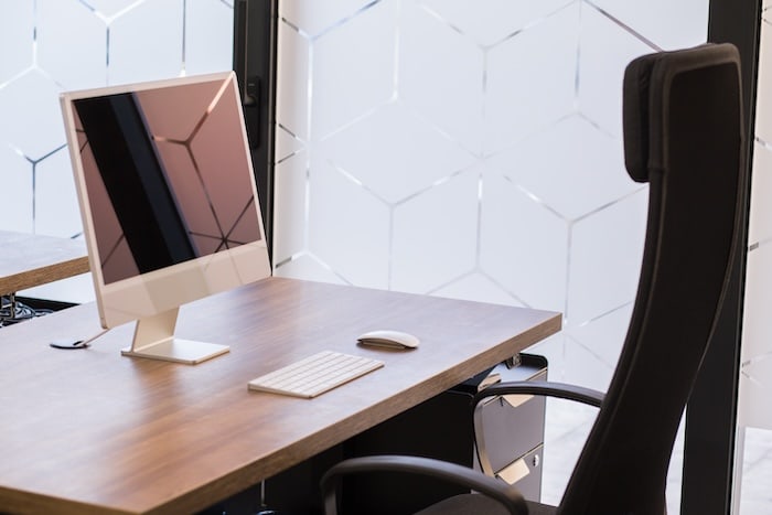 Fully equipped workstation with external monitor and ergonomic chair